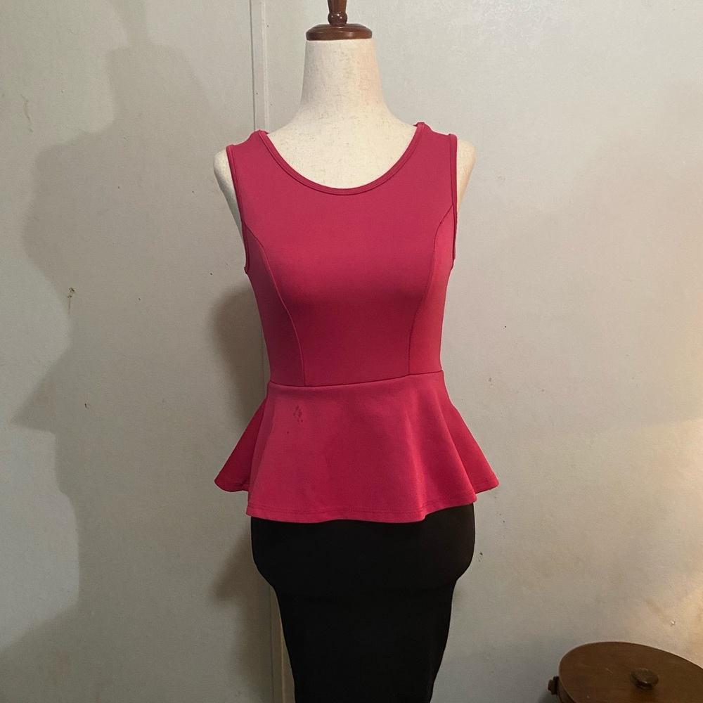 Pink and black peplum interview dress